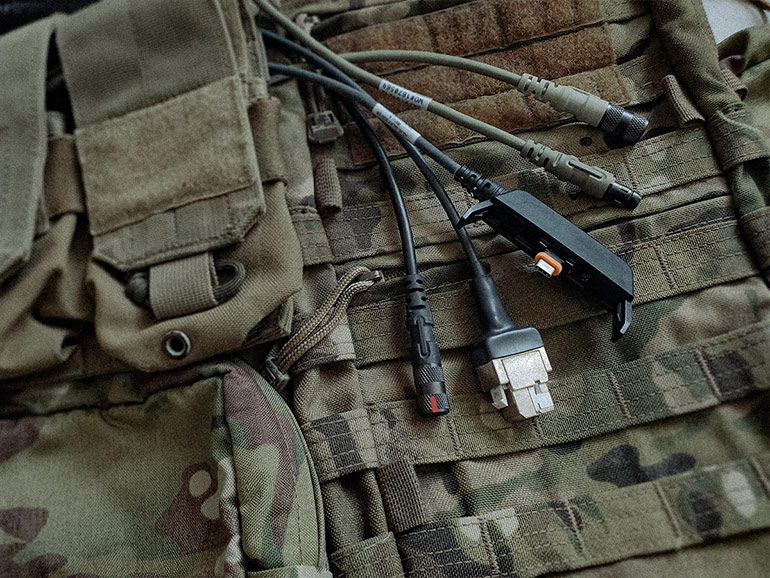 Cables/connectors developed for the Fischer Keystone tactical hub, from top to bottom: plug-to-receptacle cable, plug-to-plug  cable, plug-to-Juggernaut IMPCT cable, plug-to-RJ45 receptacle cable, plug-to-receptacle cable.